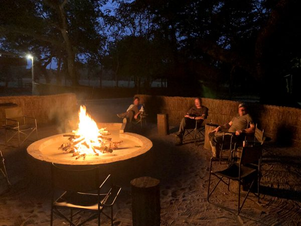 Hunters around the fire after the hunt in Mozambique