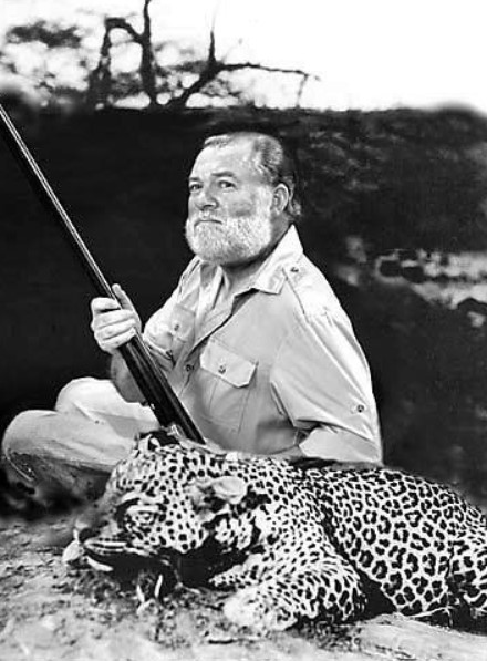 Ernest Hamingway with his leopard just hunted in an african safari