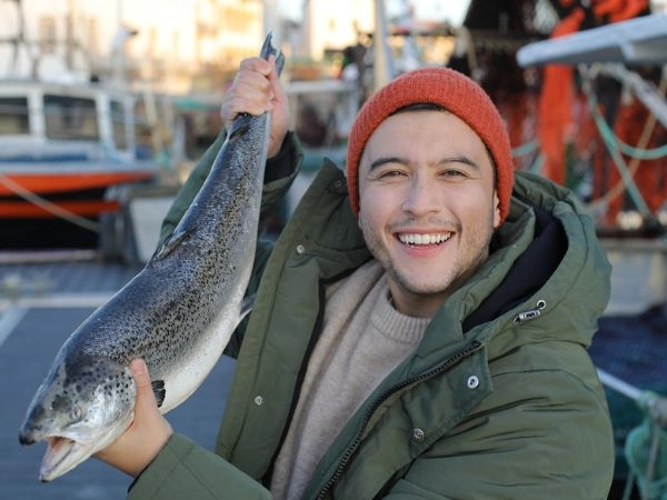 Fisherman displaying a salmon
