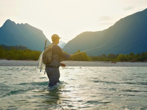 A man fly fishing in the river