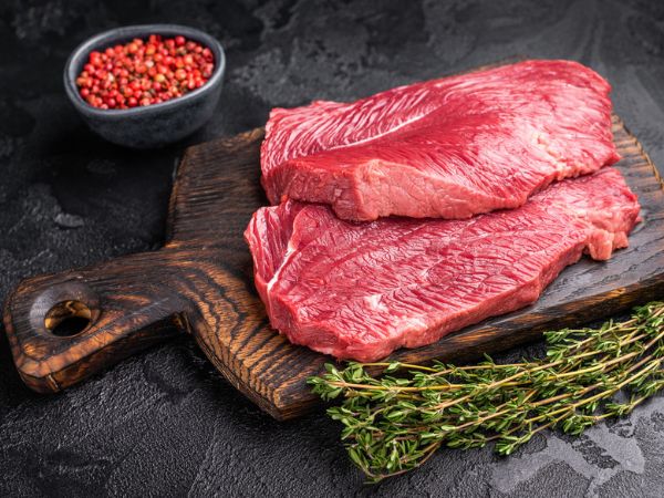 Raw wild game meat on a cutting board 